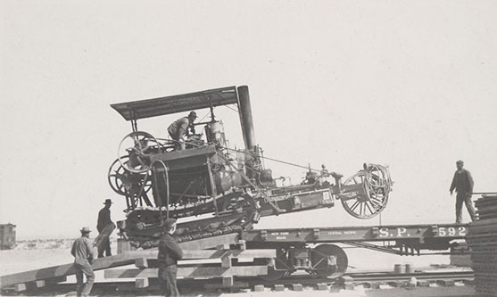 loading traction engine on flat car